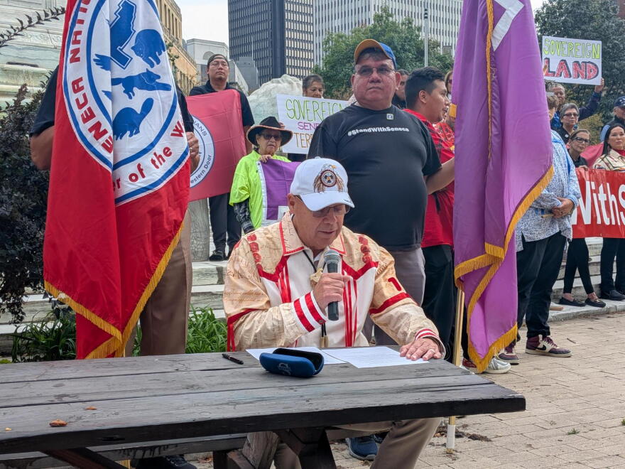 President JC Seneca presenting an executive order during a rally in Niagara Square, or as he proclaimed it: "Seneca Circle"