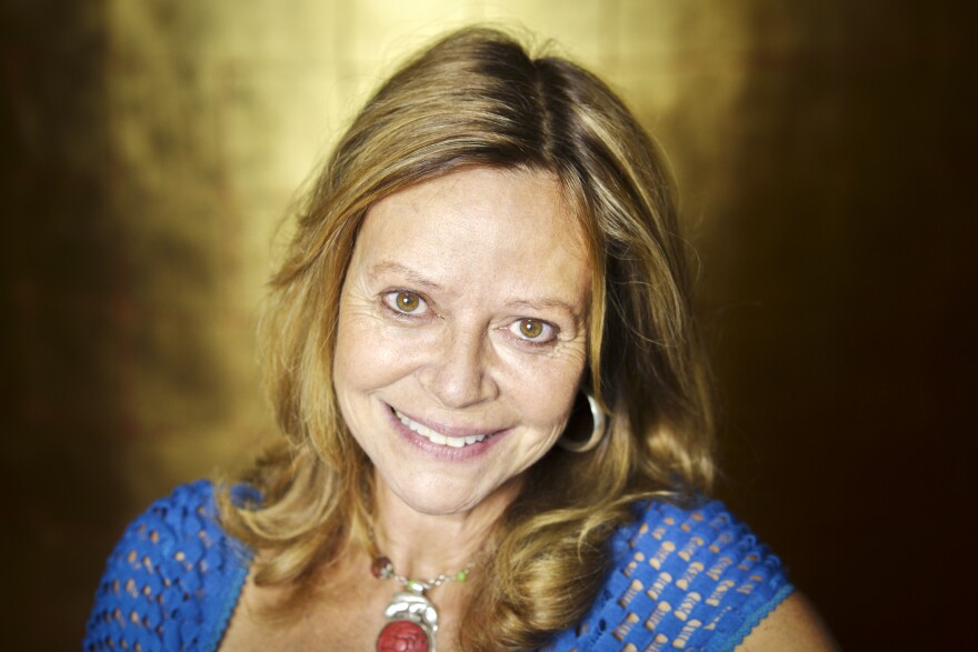 American writer Joyce Maynard poses during a portrait session held on September 18, 2014 in Paris, France.