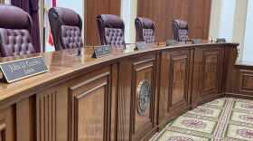 The Florida Supreme Court's bench with the visible nameplates of Justices John D. Couriel, Charles T. Canady and Chief Justice Carlos G. Muñiz on Nov. 3, 2025. (Carlton Gillespie/WLRN)