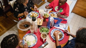 Nicole Boynes, 46, has dinner with her daughters, Sierra, 13, and Gabrielle, 10, and her mother-in-law, Germaine Boynes, 77, at their house in Silver Spring, MD on March 7, 2022. (Shuran Huang for The Washington Post via Getty Images)