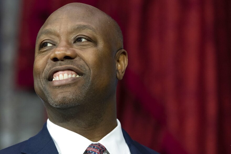 FILE - Sen. Tim Scott, R-S.C., participates in his ceremonial swearing-in by Vice President Kamala Harris, in the Old Senate Chamber on Capitol Hill in Washington, Jan. 3, 2023. Scott is speaking at an event at Drake University on Wednesday, Feb. 22, as part of what aides call a national listening tour aimed at informing his plans, before addressing the annual Polk County Republican fundraiser in suburban Des Moines that evening. (AP Photo/Jacquelyn Martin, File)