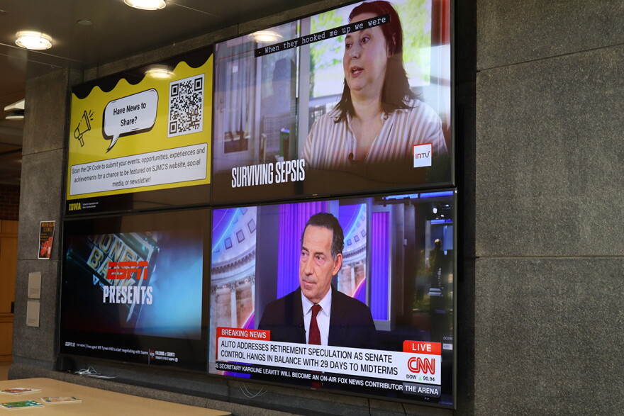 Several news feeds are displayed at the Alder Journalism building on the University of Iowa campus.
