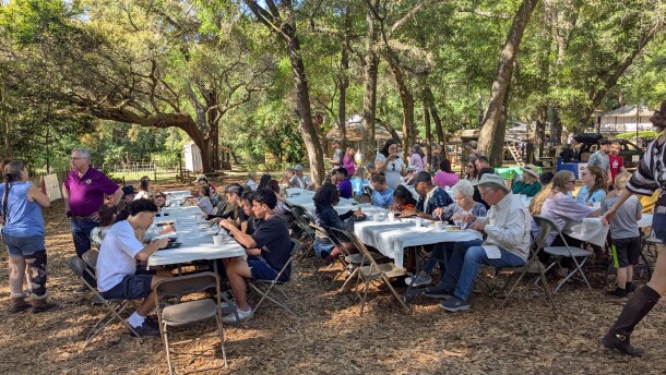 Pancakes, sausage, grits and eggs were enjoyed under the oaks during the museum's Pioneer Breakfast.