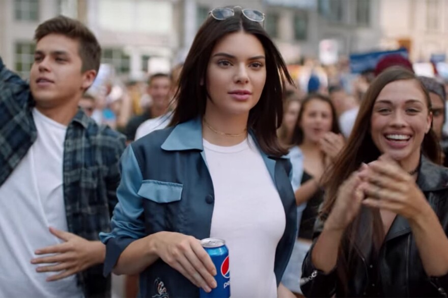 Model Kendall Jenner appears in a still from a controversial advertisement for Pepsi, which the company pulled after widespread criticism of the ad's content. (Pepsi) 