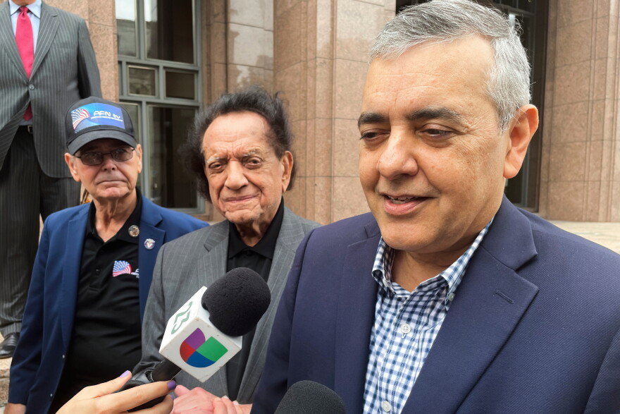FILE - Former U.S. Rep. David Rivera speaks with media outside a federal court in Miami, Dec. 20, 2022.