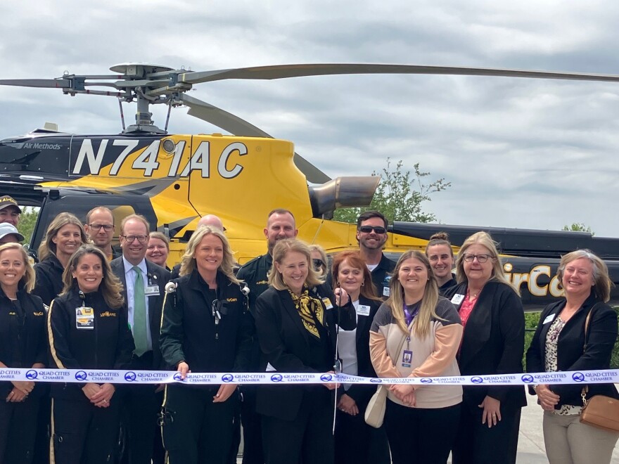 Officials affiliated with University of Iowa Health Care's AirCare medical transport cut the ribbon for a new helipad in Davenport, Thursday, MY 21, 2026.