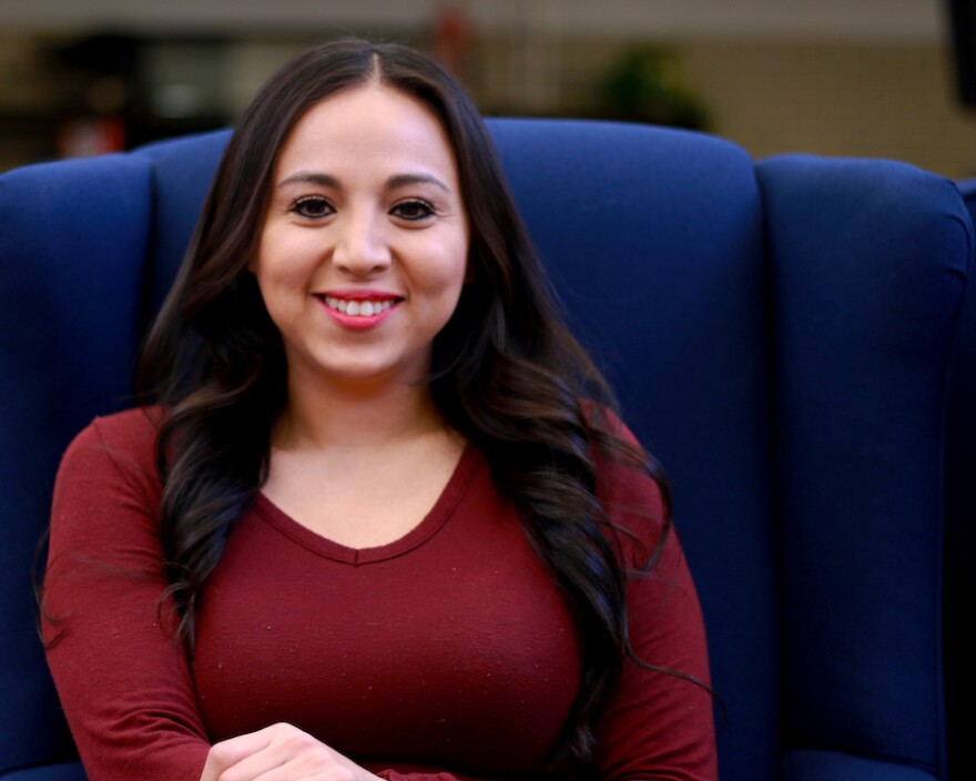 Janeth Vazquez sitting in a chair.