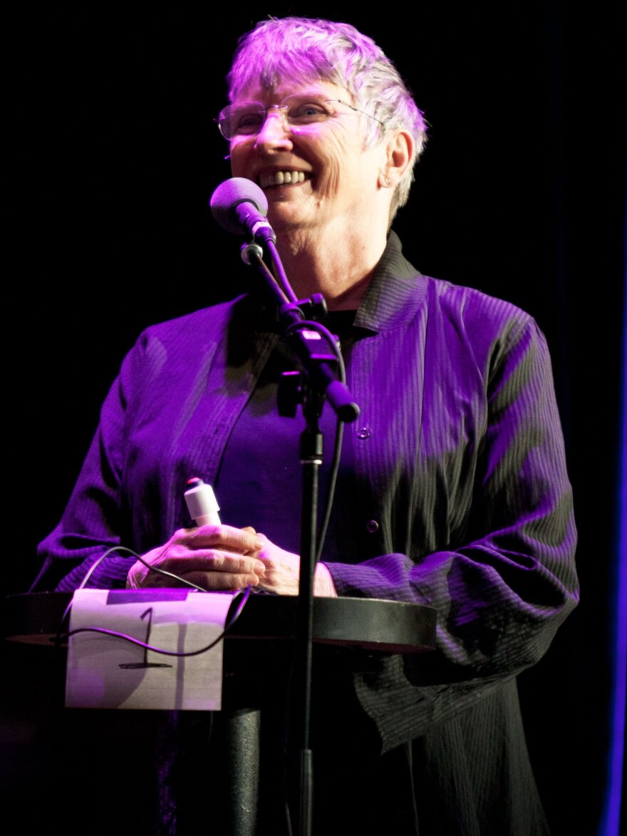 Lois Lowry plays a game called "Product Placement" on the Ask Me Another stage at Wilbur Theatre in Boston.