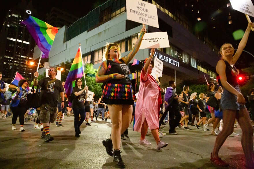 Members of the Indeed sponsored float march in the Austin Pride Parade on South Congress Avenue in downtown Austin, TX on August 20, 2022. Stephanie Tacy for KUT