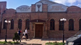 After evening prayers at this synagogue in Donetsk, Ukraine, earlier this week, a group of masked men in camouflage distributed a stack of leaflets that instructed local Jews to come to occupied buildings to register or face expulsion.