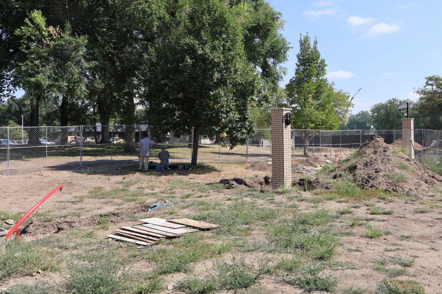 A member of the State Historical Society of North Dakota and a member of the North Dakota Geological Survey perform soil tests on Aug. 26, 2026, near the governor’s residence where human remains were discovered as part of a fence and driveway project on the Capitol grounds.