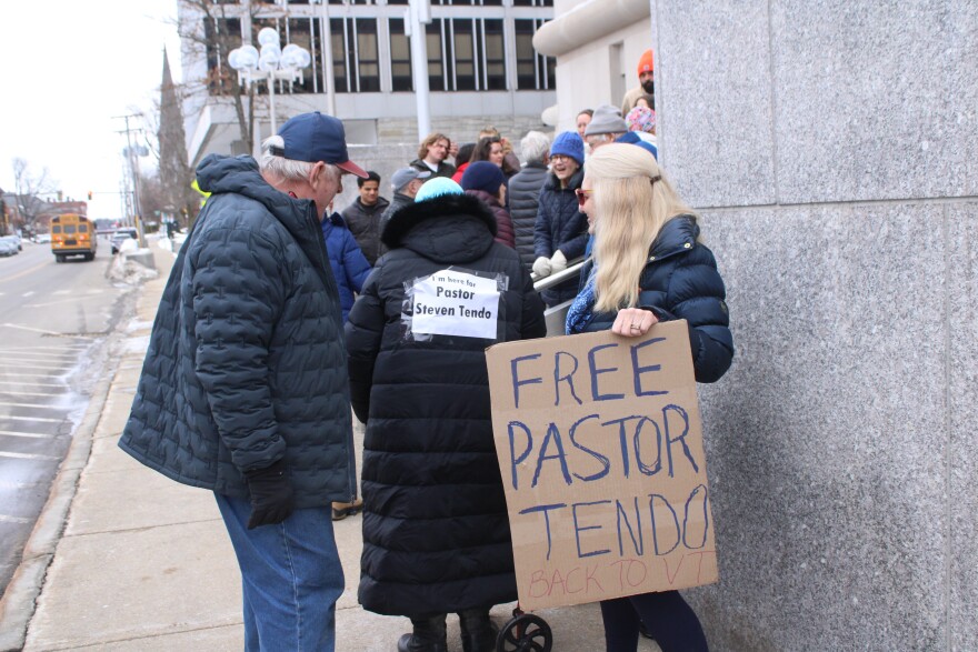 Supporters of Steven Tendo, a Vermont pastor and asylum seeker from Uganda who was detained by ICE, stand outside the Concord Courthouse on Friday, Jan. 20, 2026.