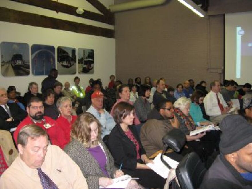 A crowd of Metro users packs the agency's board room as members discuss possible service reductions