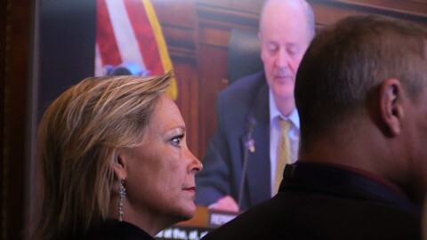 a woman in front of a TV