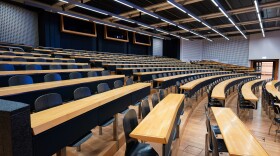rows of seats and desks in a lecture hall