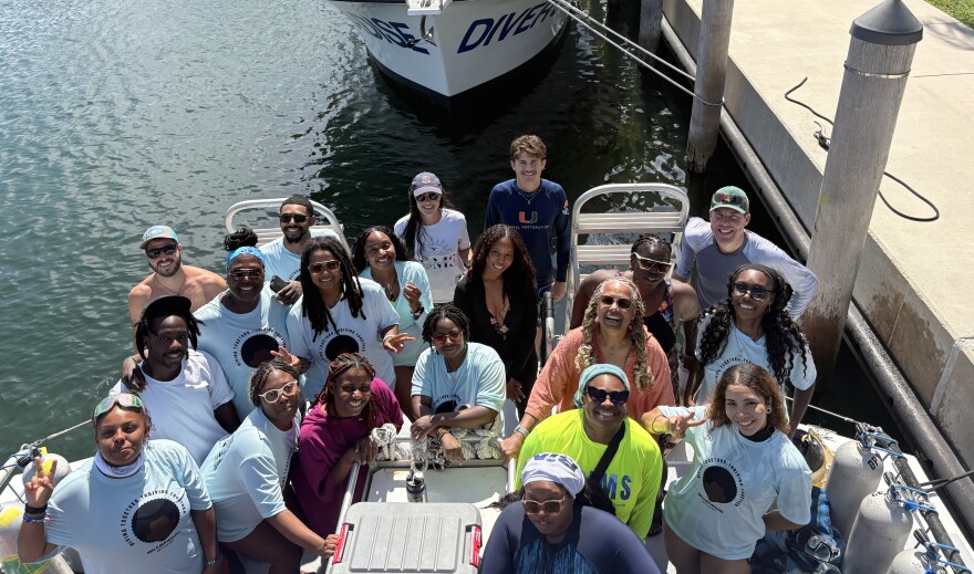 Rescue a Reef and Black in Marine Science members pose together after the dive