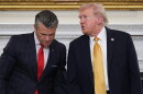 FILE - President Donald Trump talks with Defense Secretary Pete Hegseth after a roundtable on criminal cartels in the State Dining Room of the White House, Oct. 23, 2025, in Washington.