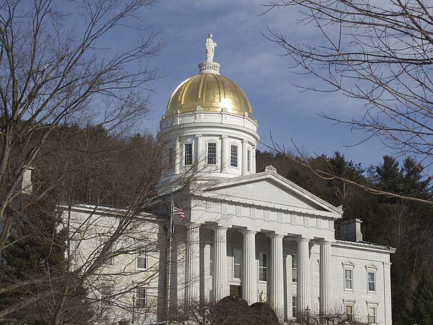 A while building with a golden dome. 