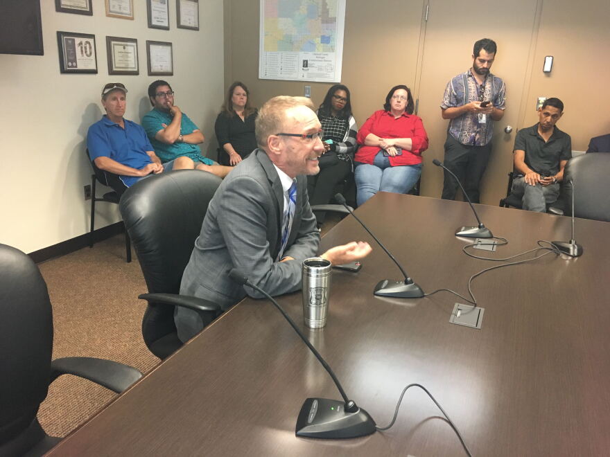 Ferndale Mayor David Coulter speaks with the Oakland County Commissioners' Democratic caucus.