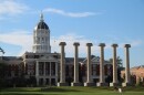 A wide shot image, slightly off center, of the MU campus quad including the columns and Jesse Hall