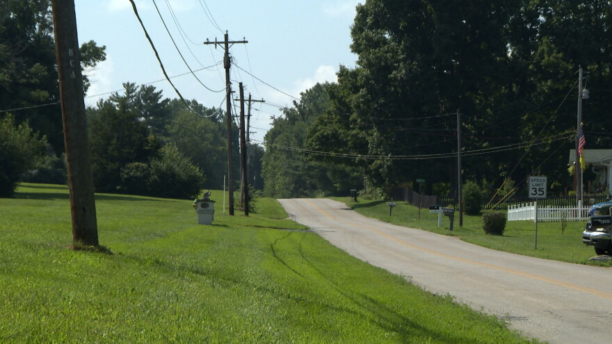 A rural road stretches into the distance.