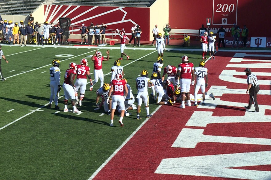 Michael Penix Jr. celebrates a third quarter touchdown after handing it off to running back Stevie Scott III on the goal line.