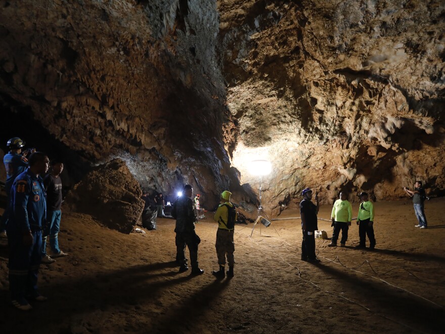 Rescue teams in Thailand gather in a cave where a group of boys and their soccer coach went missing on Saturday afternoon. Despite heavy rains that have obstructed searches, officials believe they are still alive.
