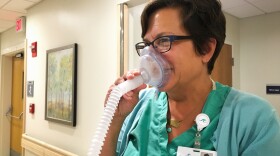 Nurse-midwife Cynthia Voytas demonstrates equipment used to deliver nitrous oxide at South County Hospital in South Kingstown, R.I.