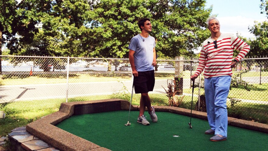 Dylan Dethier and NPR's Scott Simon enjoy a round of putt-putt golf at the East Potomac Golf Course in Washington, D.C.