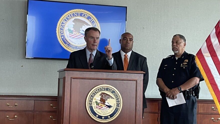 Indianapolis Mayor Joe Hogsett, U.S. Attorney Zachary Myers and IMPD Chief Randal Taylor speak at a 2023 press conference where the attorney positions were announced.