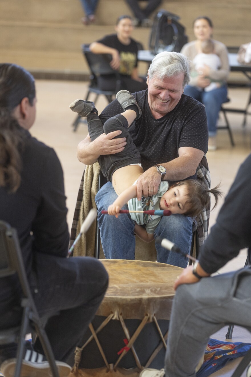 Dan Rutledge and his grandson Beau Waterman, Jr., participate in the drum circle with members of the Prairie Rose Wellbriety, a group for Native Americans in recovery, for people trying to get sober, or friends and family supporting them.