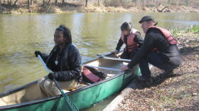 Dan Forman helps middle school students Maritza Zamora and RonDeaja Craig get underway on a City Park lagoon.