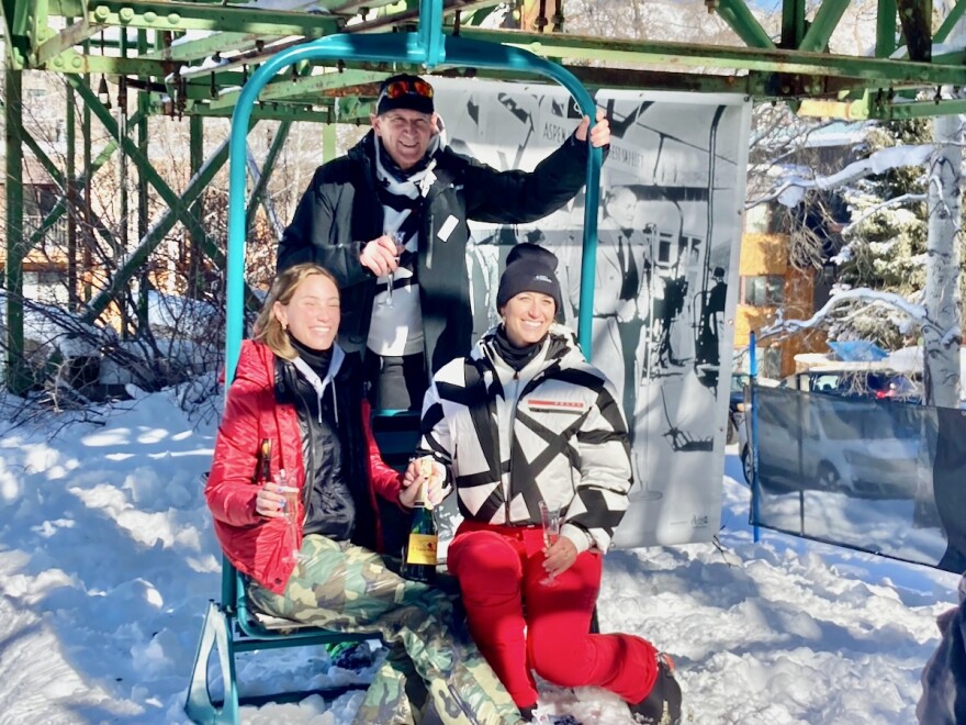 Jim Crown, center, at the 75th anniversary celebration of Lift 1A on Aspen Mountain on Jan. 11, 2022. At the event, Crown introduced the two women in the photo as his daughters, Summer, left, and Hayley.