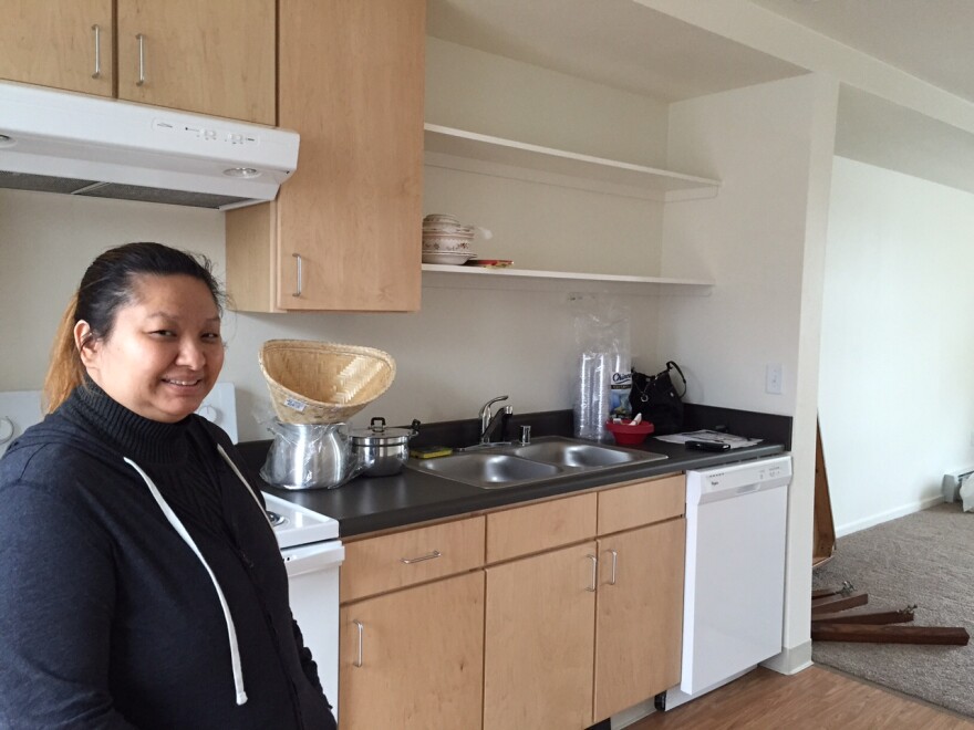 Mae Lee in her new apartment at Susitna Square. (Hillman/KSKA)