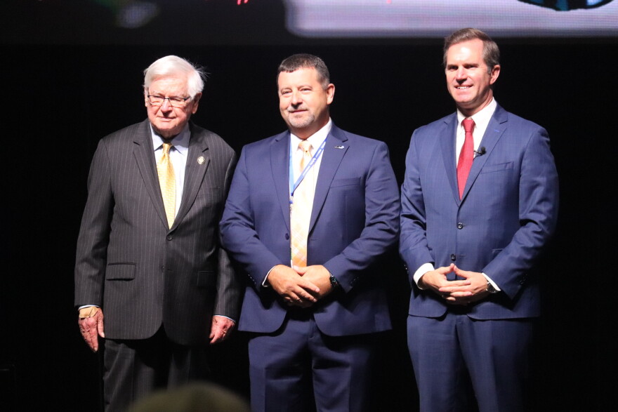 From left, U.S. Rep. Hal Rogers, Shaping Our Appalachian Region Executive Director Reed Adkins and Kentucky Gov. Andy Beshear present federal grants to Eastern Kentucky communities at a Corbin event.