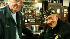 Navy veteran Howard Dunn and Army veteran Tom Kaine remember when the Red Cross briefly charged servicemen for doughnuts during World War II. Many veterans still resent it.