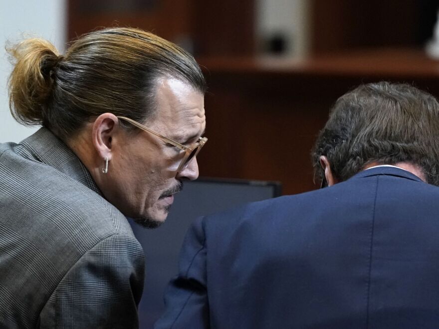 Actor Johnny Depp and his attorney Ben Chew at Fairfax County Circuit Court on Wednesday.