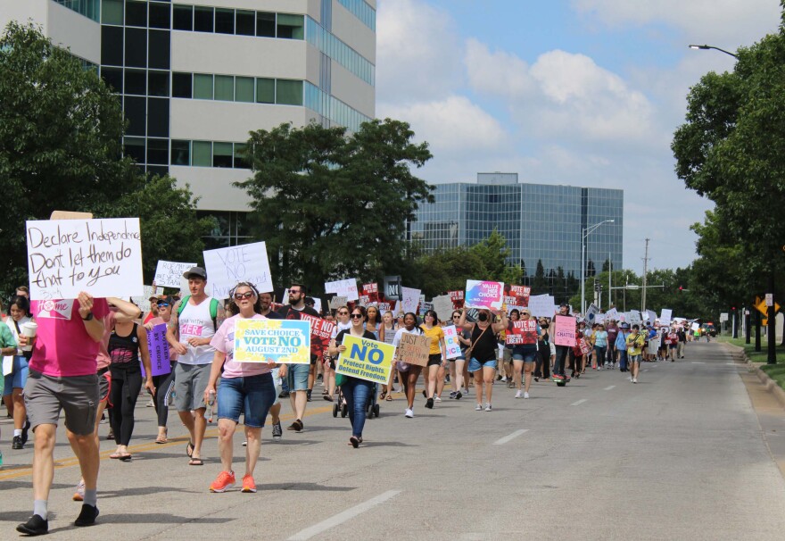 About a thousand people march south on Main Street in downtown Wichita for abortion rights.