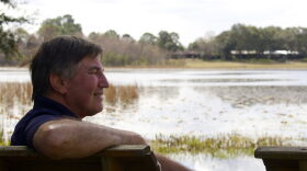 LOOKING FOR ANSWERS – John Katterhenry, 60, of Keystone Heights, Florida, looks out to the shoreline of Lake Geneva Feb. 1, 2018. Katterhenry has lived along the lake for 8 years, he said. (Max Chesnes/WUFT News)