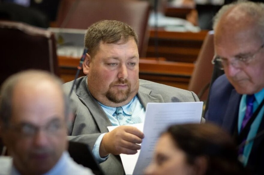 Maine Rep. Billy Bob Faulkingham, R-Winter Harbor, looks through papers at his desk in the State House in Augusta in this August 2019 file photo.