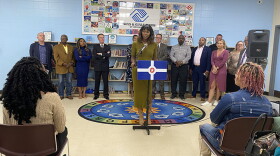 Jasmin Shaheed-Young, RISE INDY president, stands among community members as they announce the Circle City Readers initiative.