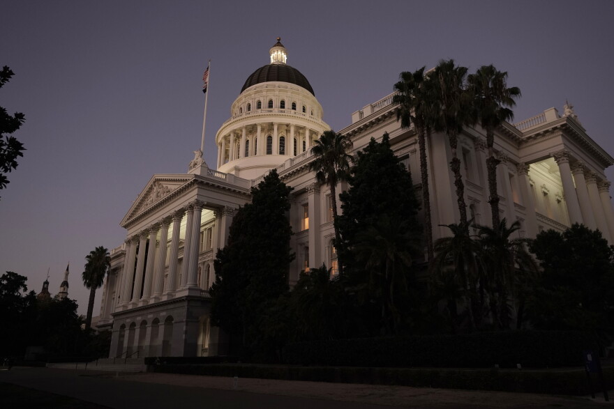 FILE - The lights of the state Capitol glow into the night in Sacramento, Calif., Wednesday, Aug. 31, 2022.