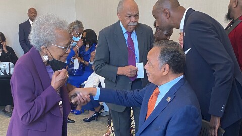 Peggy Baxter, in purple, greets the Rev. Jesse Jackson in Greenville in 2024. Baxter and Jackson worked on the effort to get MLK Day recognized as a holiday in Greenville County.
