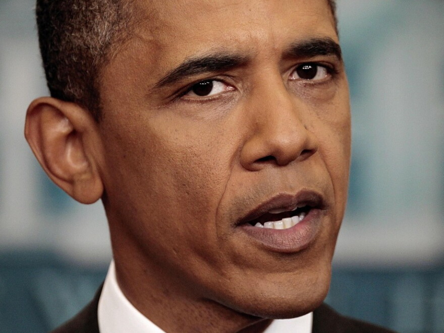 President Obama makes an opening statement on the ongoing budget negotiations before a press conference in the Brady Briefing Room of the White House in Washington on Friday.