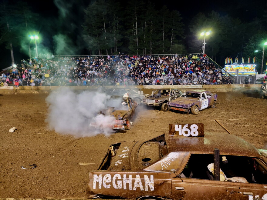 Bent axles and engine smoke all around after a collision in the V8 heat at the Hopkinton Fair Demolition Derby, Sept. 6, 2026.