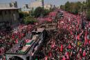 The truck carrying the coffins of the slain Iranian Supreme Leader Ayatollah Ali Khamenei and members of his family makes its way through mourners during the funeral procession toward Azadi Tower in Tehran, Iran, Monday, July 6, 2026. (Vahid Salemi/AP)