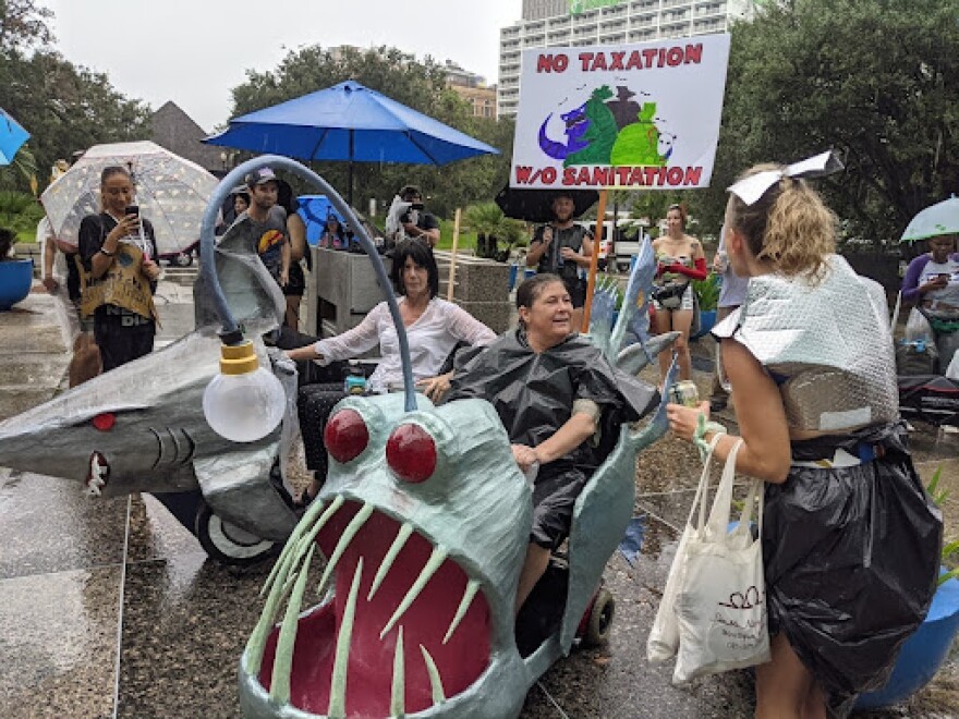 Protesters gathered outside of City Hall on Sept. 18, 2021, for a march driven by the garbage pickup issues in Hurricane Ida's wake.