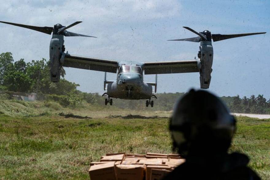 A U.S. Marine Osprey aircraft lands at Jeremie, Haiti, on Saturday as part of a Joint Task Force Haiti operation to get long-awaited relief supplies to remote communities hard hit by the August 14 earthquake.