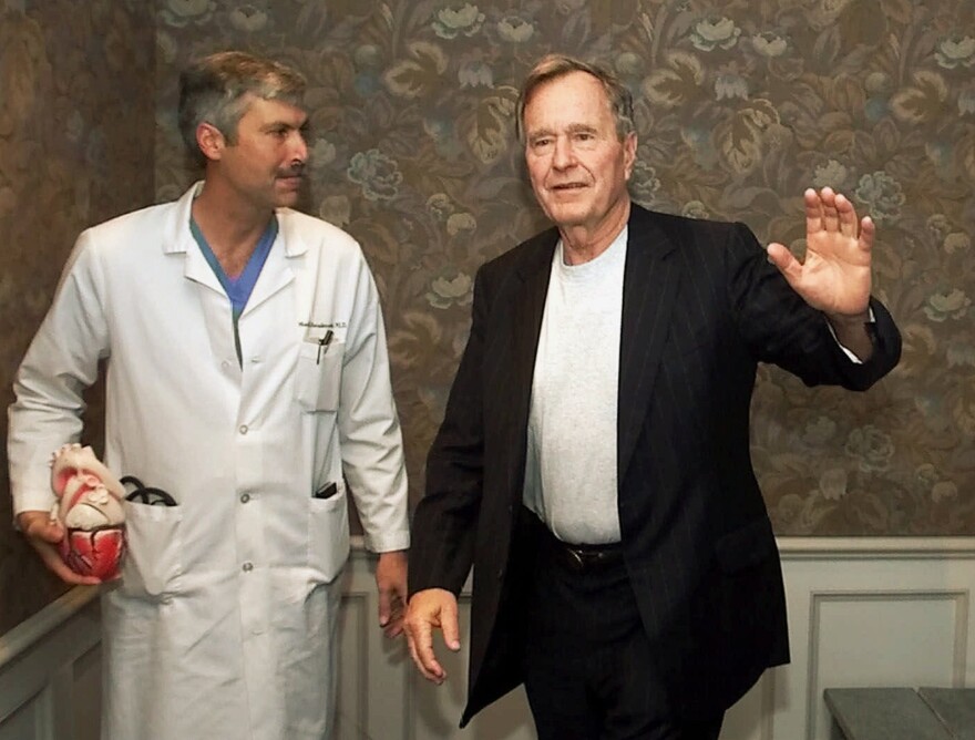 Hausknecht accompanies Bush as the former president leaves Houston's Methodist Hospital in February 2000.