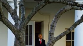 President Trump emerges from the Oval Office Wednesday as he departs the White House en route to Mar-a-Lago, where he will spend Christmas and New Years Eve.